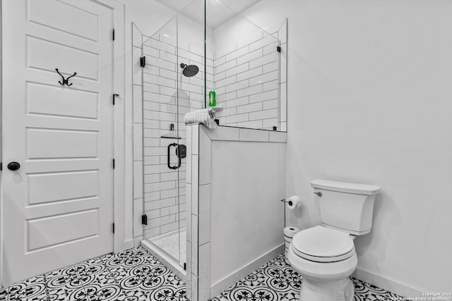 full bathroom with baseboards, tile patterned floors, a stall shower, and toilet