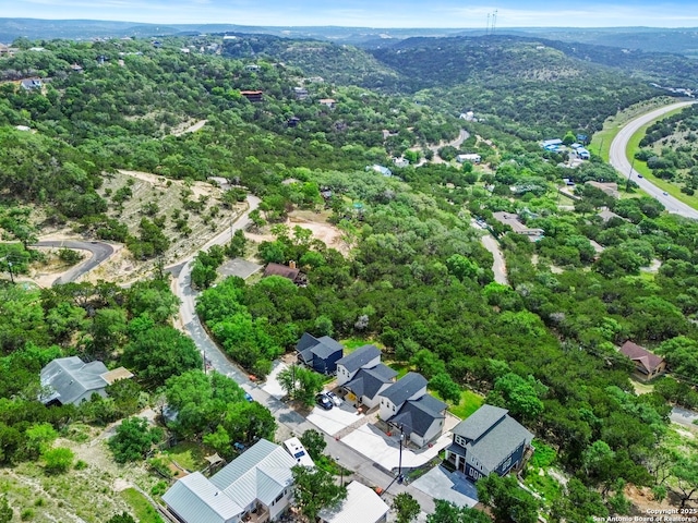 aerial view featuring a residential view and a forest view