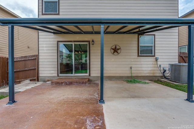 view of patio featuring fence and central AC unit