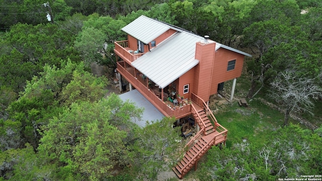 277 Riviera, Canyon Lake, TX 78133 - drone / aerial view featuring a wooded view