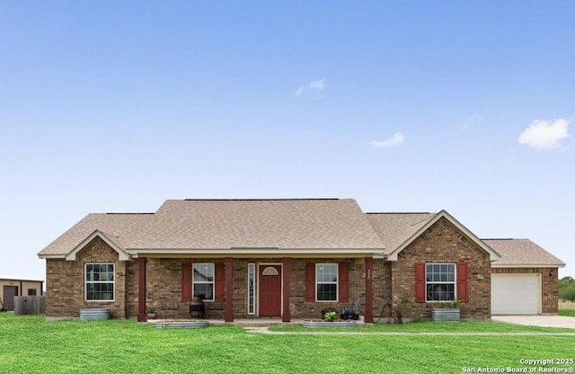ranch-style home with driveway, roof with shingles, brick siding, a front lawn, and an attached garage