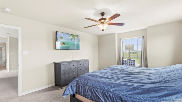 bedroom with carpet flooring, baseboards, and ceiling fan