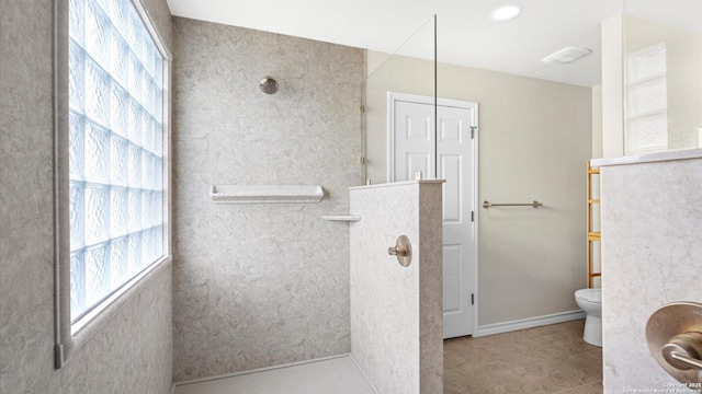 full bath with tile patterned floors, baseboards, walk in shower, and toilet