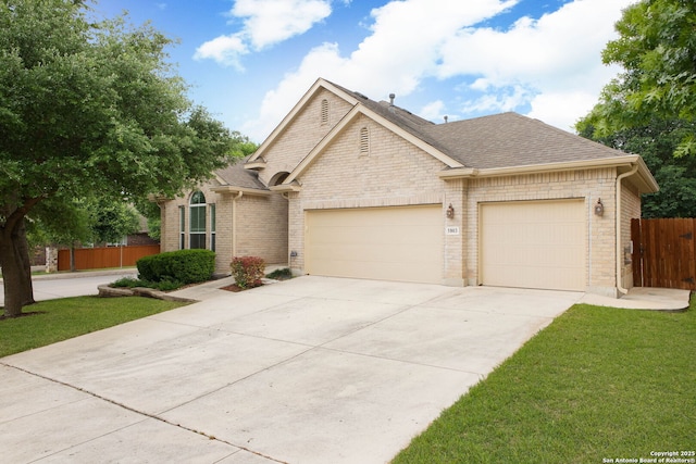 5803 Sugarberry, San Antonio, TX 78253 - single story home with fence, a shingled roof, brick siding, a garage, and driveway