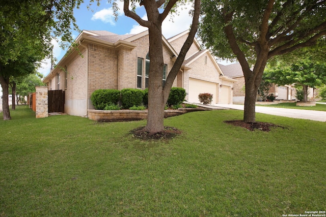 5803 Sugarberry, San Antonio, TX 78253 - view of front of home featuring brick siding, a garage, driveway, and a front yard