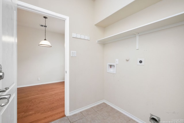 5803 Sugarberry, San Antonio, TX 78253 - laundry room with laundry area, hookup for a washing machine, gas dryer hookup, baseboards, and hookup for an electric dryer