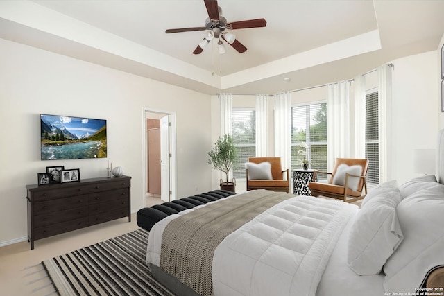 5803 Sugarberry, San Antonio, TX 78253 - bedroom with light colored carpet, a ceiling fan, a raised ceiling, and baseboards