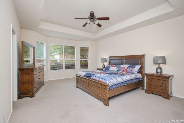 5803 Sugarberry, San Antonio, TX 78253 - bedroom featuring baseboards, a ceiling fan, a tray ceiling, and light colored carpet