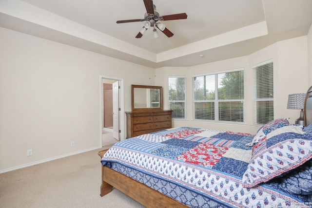 5803 Sugarberry, San Antonio, TX 78253 - bedroom featuring carpet floors, baseboards, a raised ceiling, connected bathroom, and a ceiling fan