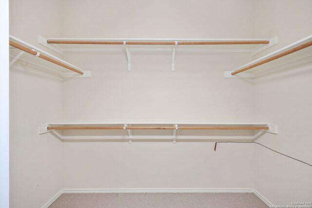 5803 Sugarberry, San Antonio, TX 78253 - walk in closet featuring carpet