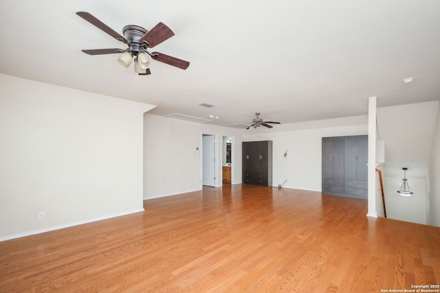 5803 Sugarberry, San Antonio, TX 78253 - spare room with light wood-type flooring, a ceiling fan, visible vents, and attic access