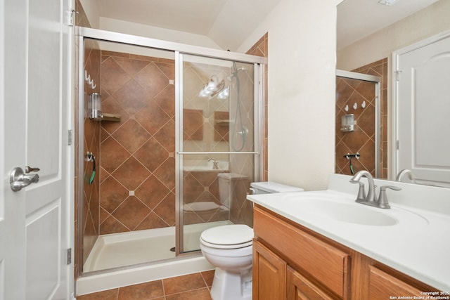 5803 Sugarberry, San Antonio, TX 78253 - bathroom featuring vanity, tile patterned floors, a stall shower, and toilet