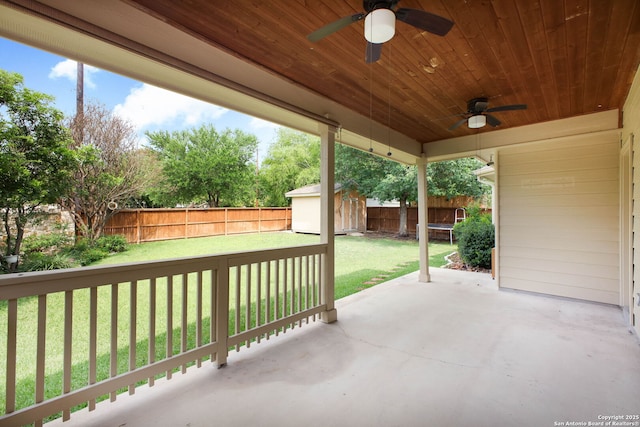 5803 Sugarberry, San Antonio, TX 78253 - view of patio / terrace featuring an outdoor structure, a fenced backyard, ceiling fan, and a shed
