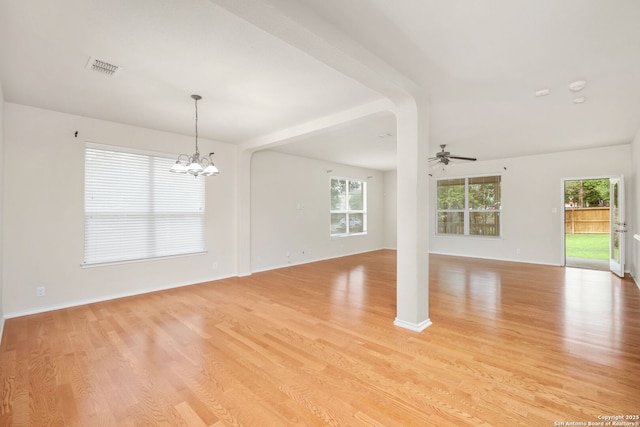 5803 Sugarberry, San Antonio, TX 78253 - spare room featuring baseboards, ceiling fan with notable chandelier, light wood-type flooring, and visible vents