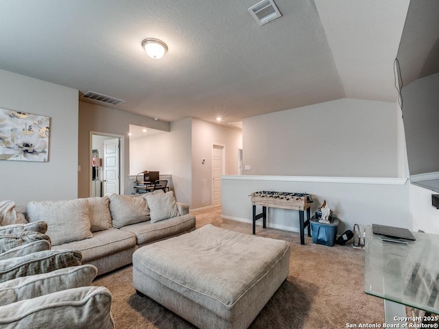 carpeted living area featuring visible vents