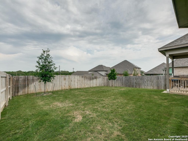 view of yard featuring a fenced backyard