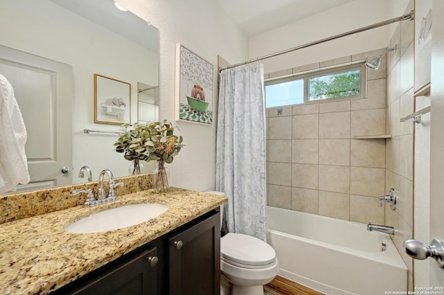bathroom with vanity, toilet, and shower / tub combo