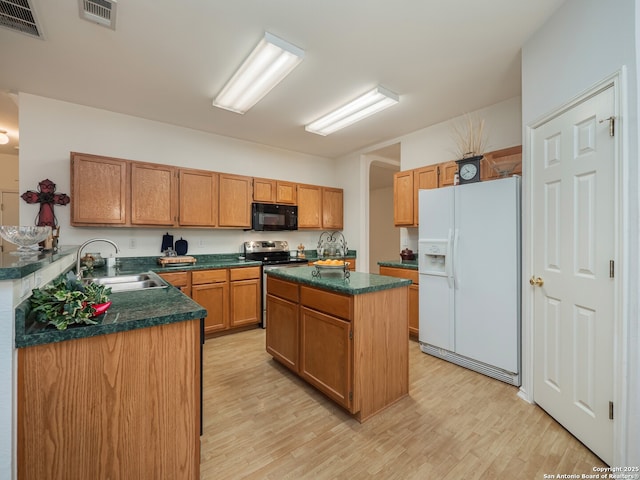 3608 Augusta Glade, Schertz, TX 78154 - kitchen featuring visible vents, black microwave, white refrigerator with ice dispenser, stainless steel range with electric cooktop, and a sink