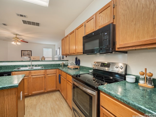 3608 Augusta Glade, Schertz, TX 78154 - kitchen with visible vents, a sink, black appliances, and light wood-type flooring
