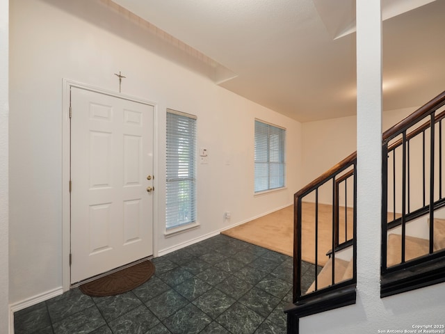 3608 Augusta Glade, Schertz, TX 78154 - foyer featuring stairs, baseboards, and dark carpet