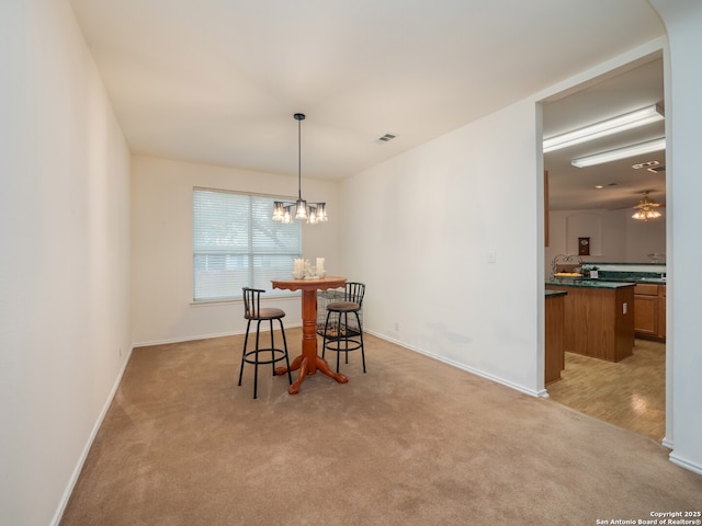 3608 Augusta Glade, Schertz, TX 78154 - dining area with a notable chandelier, baseboards, and light colored carpet