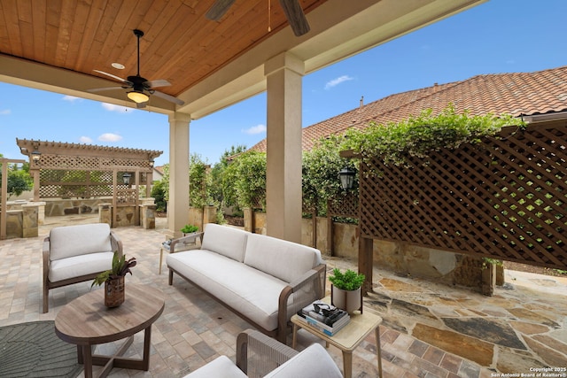 view of patio / terrace with fence, an outdoor living space with a fireplace, ceiling fan, and area for grilling