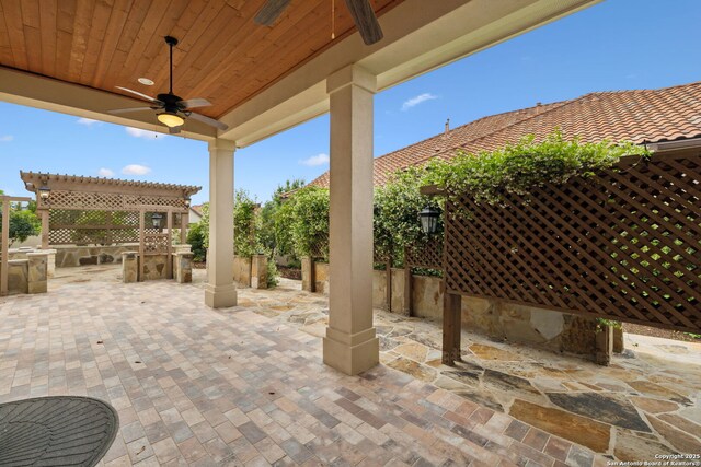 view of patio / terrace with fence, a ceiling fan, and area for grilling