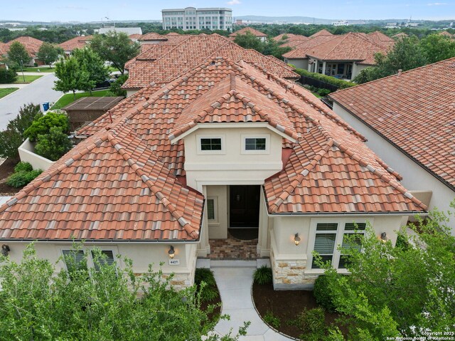 mediterranean / spanish-style house with a tiled roof and stucco siding
