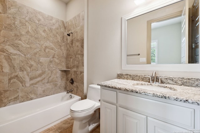 bathroom featuring vanity, bathtub / shower combination, and toilet