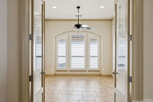 interior space featuring french doors, a ceiling fan, baseboards, and visible vents