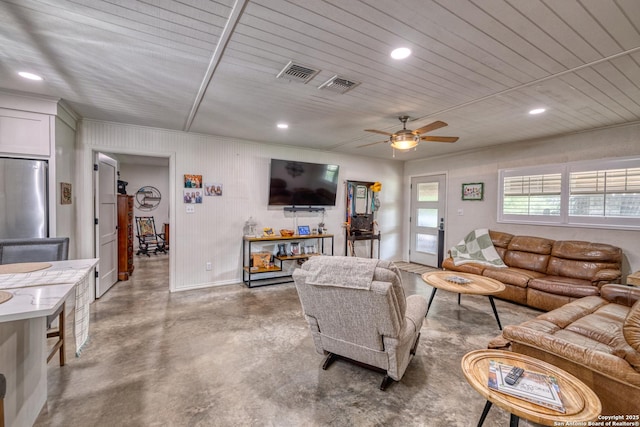 living area featuring recessed lighting, ceiling fan, visible vents, and finished concrete flooring