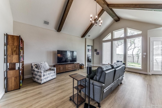 living area featuring visible vents, beam ceiling, high vaulted ceiling, light wood finished floors, and a chandelier