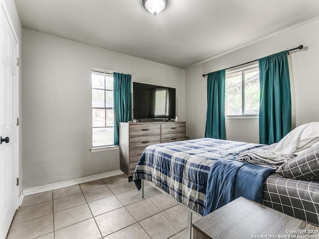 tiled bedroom with baseboards