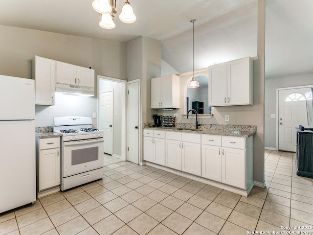 kitchen featuring white cabinetry, a sink, under cabinet range hood, white appliances, and light tile patterned flooring
