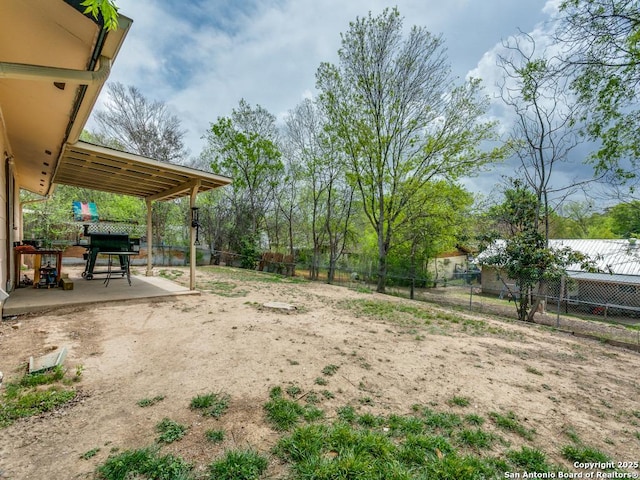 view of yard featuring a fenced backyard and a patio area