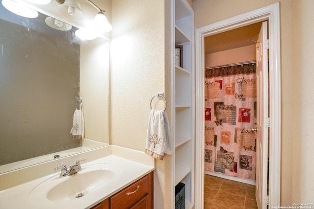 full bathroom featuring vanity, a shower with curtain, and tile patterned floors