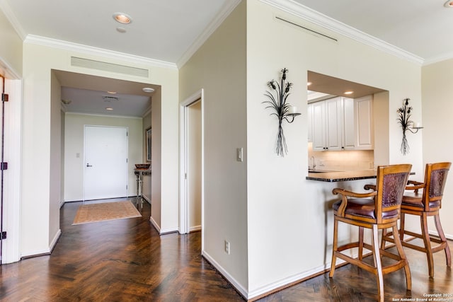 200 Patterson Unit 312, San Antonio, TX 78209 - hall featuring baseboards, visible vents, ornamental molding, and a sink