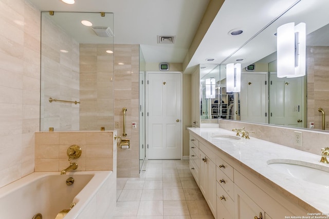 200 Patterson Unit 312, San Antonio, TX 78209 - full bathroom featuring tile patterned floors, visible vents, a tub with jets, and a sink