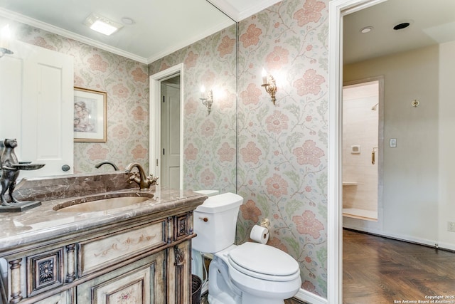 200 Patterson Unit 312, San Antonio, TX 78209 - bathroom with vanity, crown molding, toilet, baseboards, and wallpapered walls