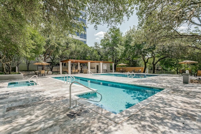 200 Patterson Unit 312, San Antonio, TX 78209 - pool featuring a hot tub, a patio area, and fence