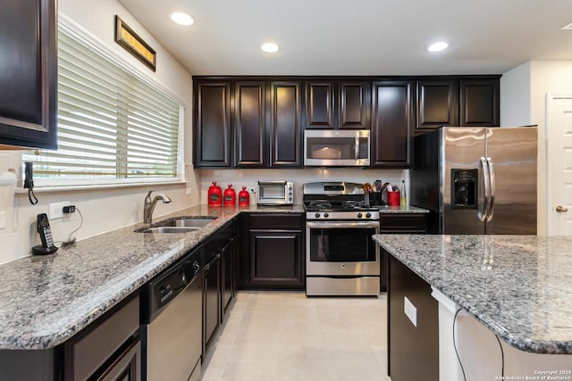 313 Creekview, New Braunfels, TX 78130 - kitchen featuring tasteful backsplash, a sink, light stone counters, light tile patterned floors, and stainless steel appliances