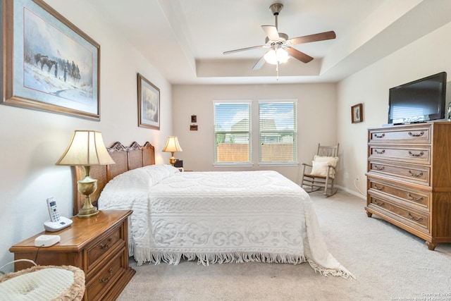 313 Creekview, New Braunfels, TX 78130 - bedroom with light colored carpet, a ceiling fan, and a raised ceiling