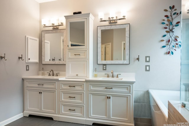 full bathroom with double vanity, a sink, and a tub