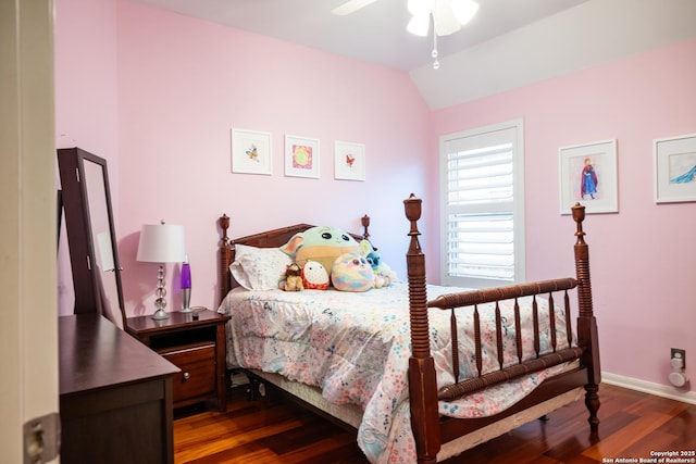 bedroom featuring baseboards, vaulted ceiling, and dark wood-style flooring