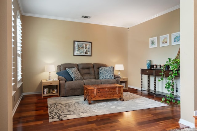 living room featuring crown molding, wood finished floors, and visible vents