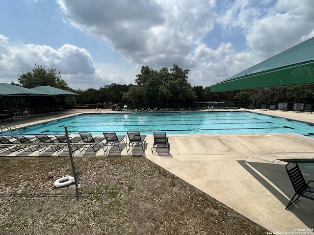 pool with a patio area