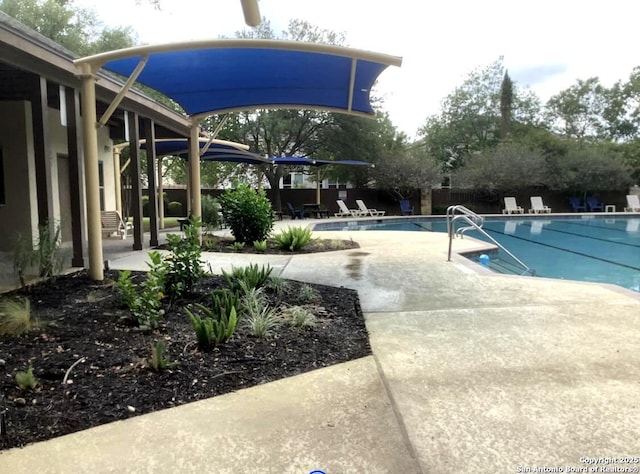 9110 Feather Blf, Helotes, TX 78023 - community pool featuring a patio and fence