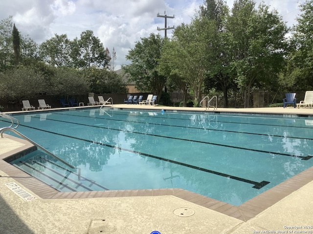 9110 Feather Blf, Helotes, TX 78023 - community pool with fence and a patio