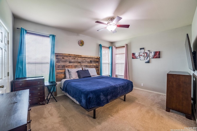 9110 Feather Blf, Helotes, TX 78023 - carpeted bedroom with ceiling fan and baseboards