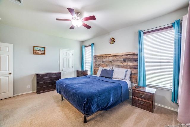 9110 Feather Blf, Helotes, TX 78023 - carpeted bedroom with baseboards and ceiling fan